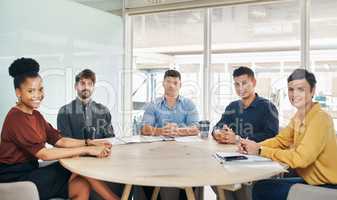 Were here to prove the excellence of our company. Portrait of a group of businesspeople having a meeting in an office.