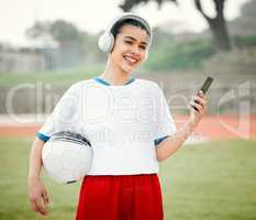 Pre-game prep. Cropped portrait of an attractive young female footballer standing outside with a soccer ball in hand.