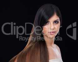 Hair and beauty unmatched. Studio shot of a beautiful brunette model with gorgeous long hair.
