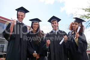 Hard work paid off. Shot of excited university students on graduation day.