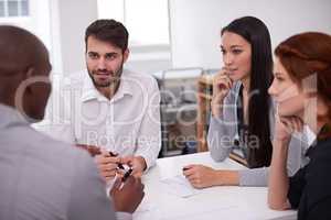 The future leaders of business. Shot of a diverse group of young businesspeople having a meeting in an office.