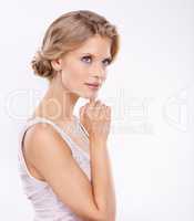 Shes got an idea. An elegant young woman isolated on a white background.