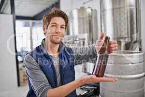 I only brew the best. Shot of a man working in a microbrewery.