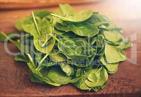 Beautifully green basil. Shot of fresh basil leaves on a kitchen tabletop.