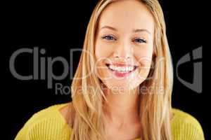 Life is beautiful. Studio portrait of a gorgeous young blonde woman with a toothy smile.