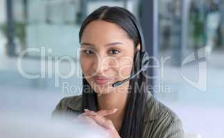 Its my duty to enhance the customer experience. Portrait of a young call centre agent working in an office.