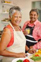 Living life happily and healthily. Shot of a happy senior couple cooking a healthy meal together at home.