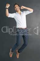 Jumping for joy. Studio shot of a happy businessman jumping for joy.