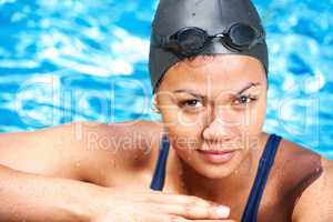 Passionate about swimming. Portrait of a pretty young female swimmer - closeup.