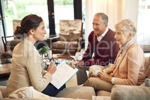 Its time to cash in our pension. Shot of a senior couple getting advice from their financial consultant.