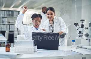 Well make history with this. Shot of a group of scientists cheering while working in a lab.