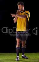 Ill be harsh but fair. Shot of a referee against a black background.