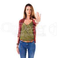 Stop right there. Studio shot of a young woman with her hand out isolated on white.