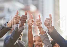 Our optimism is unbeatable. Shot of a group of businesspeople giving the thumbs up.
