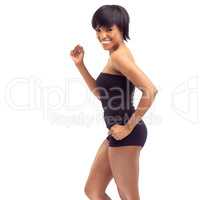 This way to fit and fantastic. Studio shot of a fit young african woman posing against a white background.