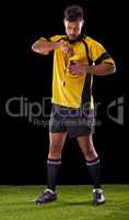 Ill be harsh but fair. Shot of a referee against a black background.