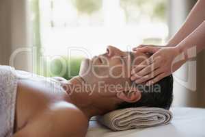 He has the best masseuse. Shot of a mature man enjoying a relaxing masasage.