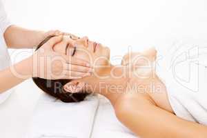 Getting in the right head space. Cropped shot of a young woman getting a beauty treatment isolated on white.