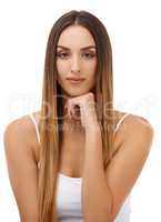 Portrait of carefree confidence. Studio portrait of an attractive model with her hand on her chin isolated on white.