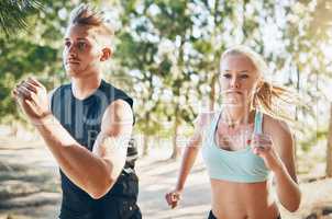 Commit to be fit. Shot of a young couple running together outside.