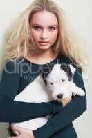 Im an animal lover. Portrait of a gorgeous young woman holding her adorable dog.