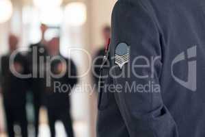 Willing and able to defend. Shot of a military badge on a high ranking officers jacket.