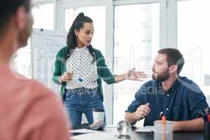 A new product needs a great marketing campaign. Shot of a team of young businesspeople sitting in on a presentation in a modern office.