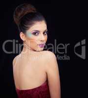 Bold and Beautiful. Head and shoulder shot of a beautiful young woman wearing bold makeup.