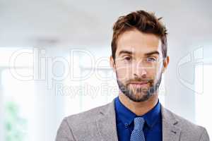 Straight forward handsome. Portrait of a man in a contemporary suit.