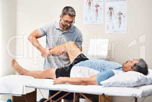 Rehabilitation is a long and important journey to full recovery. Shot of a senior man going through rehabilitation with his physiotherapist.