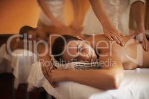 Theres no such word as stress in this room. Shot of a mature couple enjoying a relaxing massage.