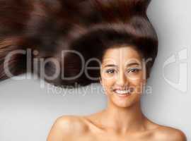 Haircare. Studio shot of a beautiful young woman with long brown hair.