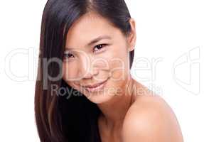 Charm and innocence. Cropped shot of a beautiful young oriental woman against a white background.