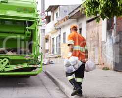 Hes keeping our streets clean. Cropped shot of a male worker on garbage day.