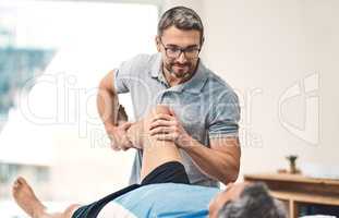 Youll be back to full speed in no time. Shot of a senior man going through rehabilitation with his physiotherapist.