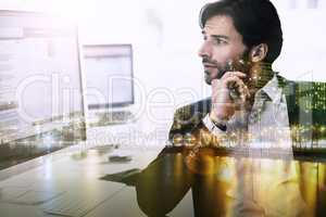 Hard work and long nights. Multiple exposure shot of a young businessman superimposed on a urban skyline at night.