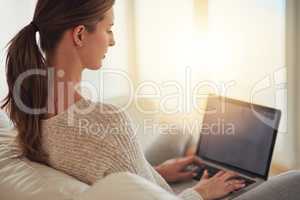 Are you looking for the perfect stay at home job. Shot of a young woman using her laptop at home.