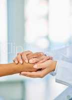 Any challenge is one well face together. Closeup shot of an unrecognizable doctor holding a patients hand in comfort.