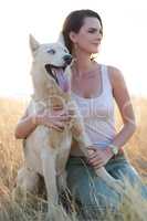 Dogs show you the meaning of unconditional love. Shot of an attractive young woman bonding with her dog outdoors.