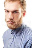 Rugged confidence. Portrait of an unshaven young man isolated on white.