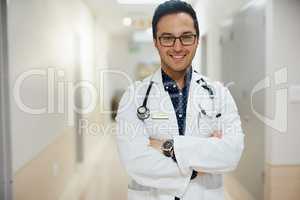 Your health is of utmost importance to me. Portrait of a male doctor standing in a hospital.