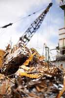 Our waste is a threat to the environment. Cropped shot of a crane at work in a dumpsite.