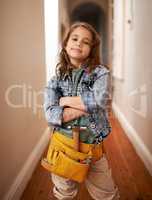 Leave the handy work to her. Shot of an adorable little girl wearing a tool belt.