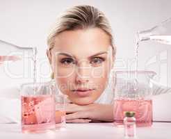 What is beautiful is good. Studio shot of young woman making a potion against a white background.