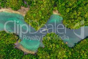 Indonesia is a beautiful place. High angle shot of a little islets and islands in the middle of Indonesia.