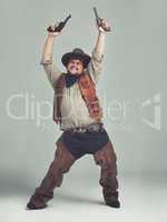 He heard The Village People needed a new cowboy.... An overweight cowboy looking ecstatic with his pistols in the air.