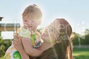 My daughter instantly brightens all of my days. Shot of a mother bonding with her little daughter outdoors.