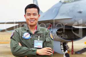 Im an fighter ace. A shot of a confident asian fighter pilot.