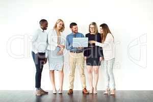 I saw this the other day. Shot of a group of work colleagues standing next to each other while using electronic devices against a white background.
