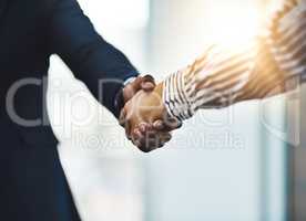 Congratulations on your outstanding achievements. Closeup shot of two businesspeople shaking hands in an office.